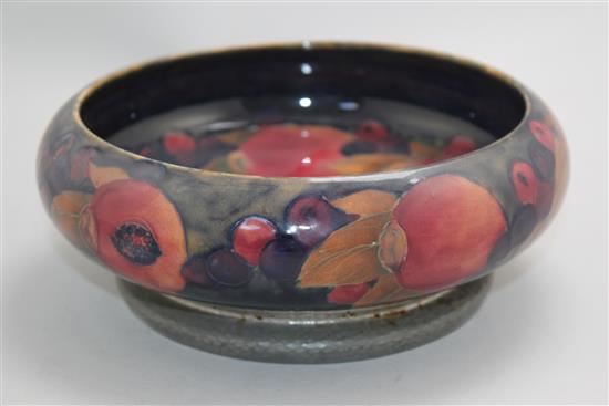 A William Moorcroft pomegranate pattern Tudric pewter mounted bowl, c.1920, 22cm, mount loose